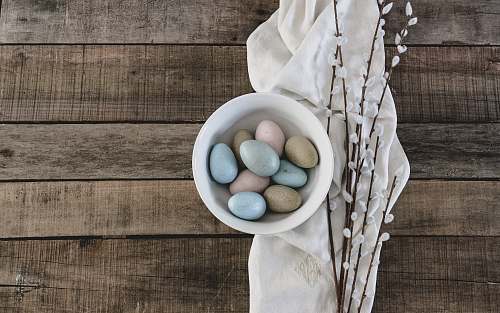 home decor blue and green egg on white ceramic bowl linen